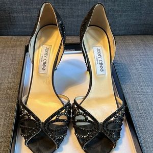 Used Black Jimmy Choo Heels size 10.5. Worn once in the rain